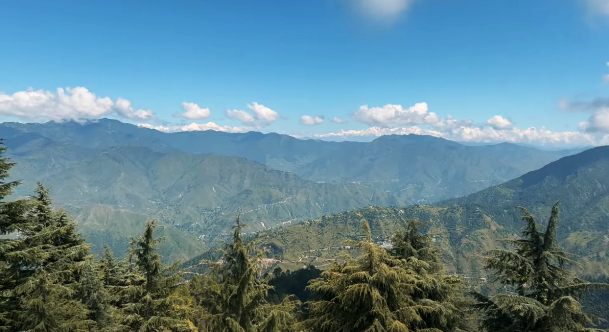 Landour travel guide 2025,Scenic view of Landour with pine forests, colonial-era houses, and the Himalayan views