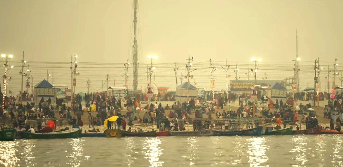 Devotees at Prayagraj Magh Mela 2026 taking holy dip at Triveni Sangam during sunrise